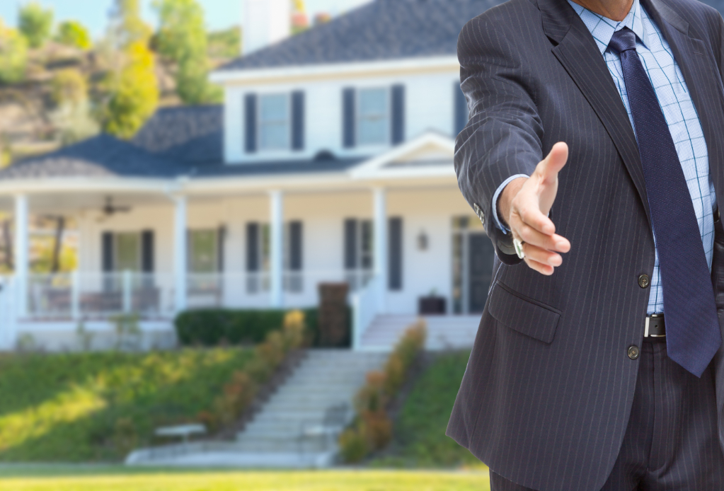 Male Agent Reaching Hand Shake Front Beautiful New House